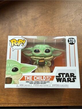 pop The Child Figure holding cup - green and tan